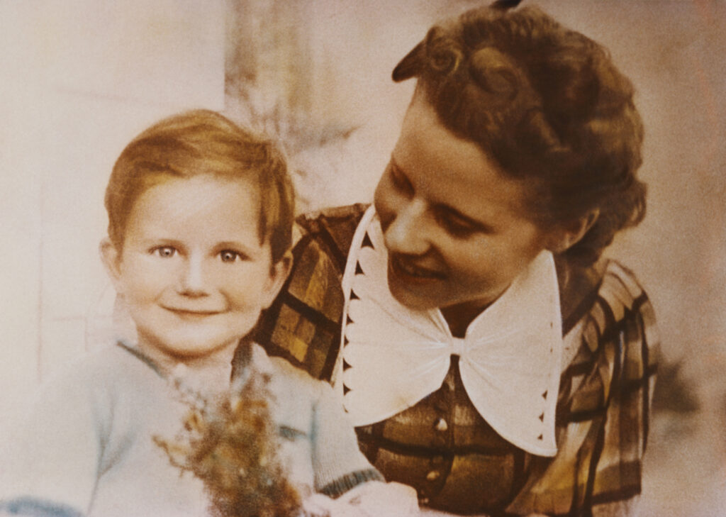 As a child, with his mother